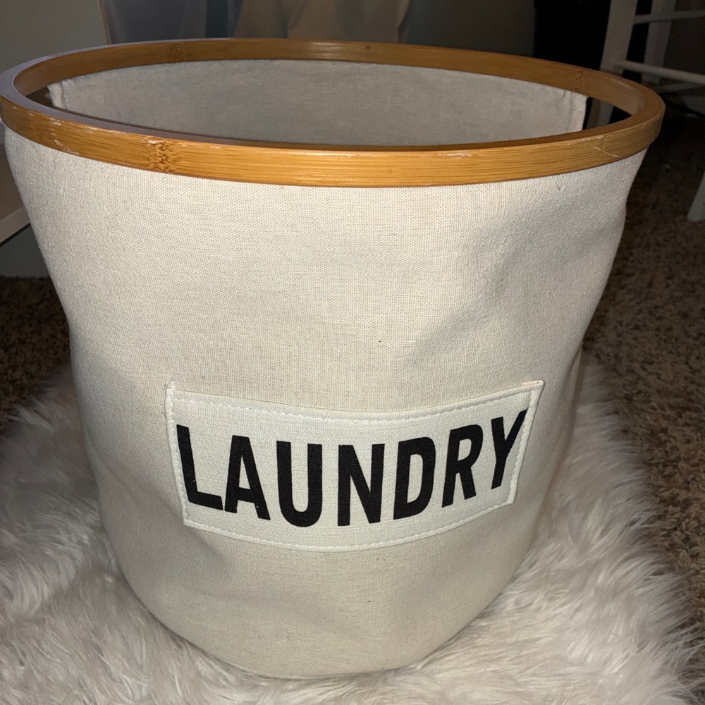 Cream Laundry Basket with Bamboo Rim Good condition.  Collapsible.